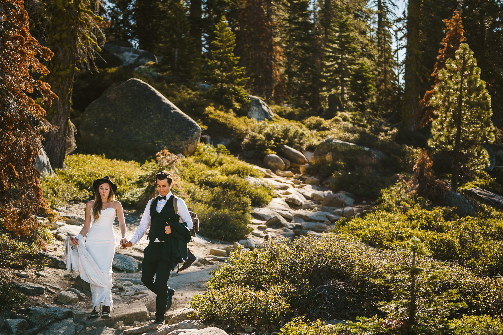 Couple heading to their elopement adventure wedding in Yosemite California at Tafts Point